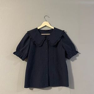 M&S button up top with ruffle trimmed collar navy blue gingham pattern